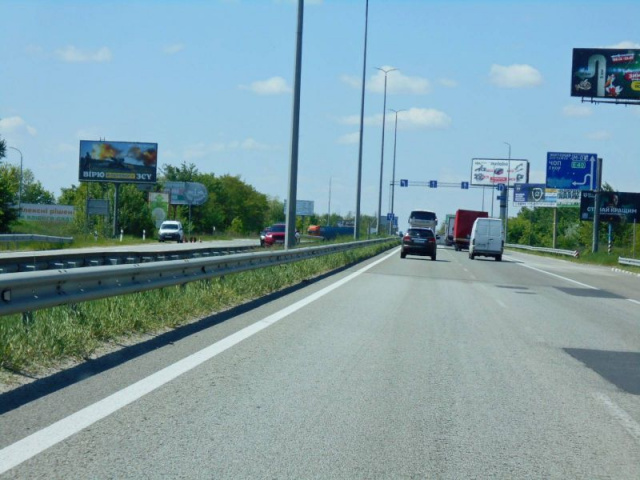 Щит 6x3,  с. Мила, траса М-06 "Київ-Чоп" (Житомир), км 26+800 ліво