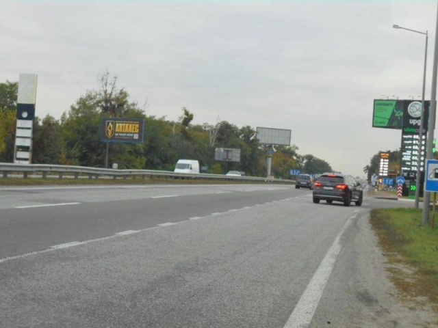 Щит 6x3,  с. Мила, траса М-06 "Київ-Чоп" (Житомир), км 27+100 ліво